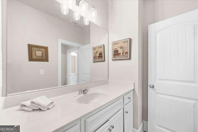 bathroom with visible vents and vanity