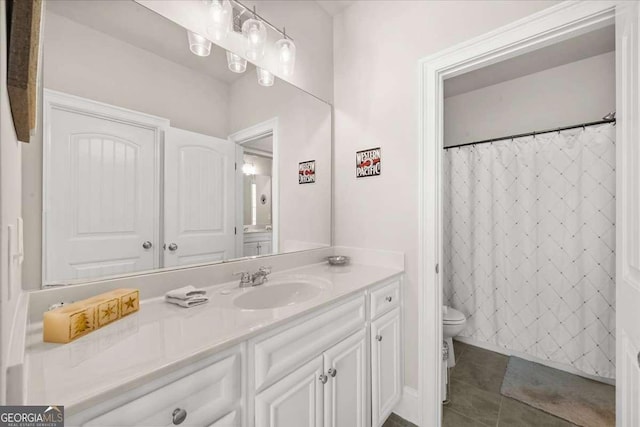 bathroom featuring tile patterned flooring, curtained shower, vanity, and toilet