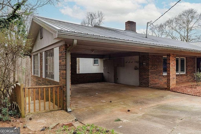 exterior space featuring an attached carport