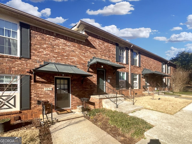 multi unit property featuring brick siding