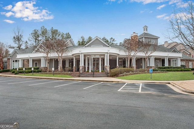 view of property with uncovered parking