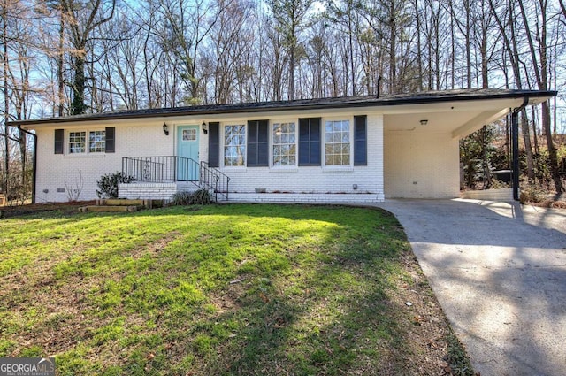 single story home featuring brick siding, concrete driveway, crawl space, a carport, and a front lawn