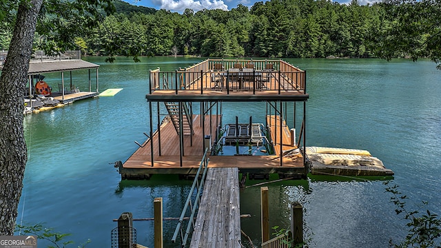 view of dock with a water view and boat lift