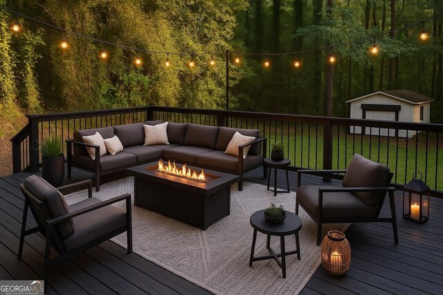 wooden deck featuring an outdoor living space with a fire pit, a yard, an outdoor structure, and a storage unit
