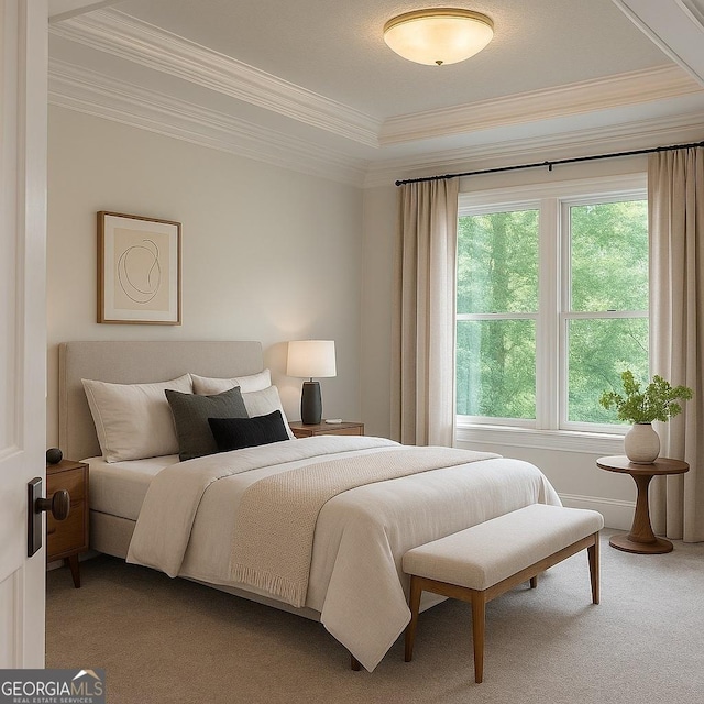 bedroom featuring ornamental molding and carpet