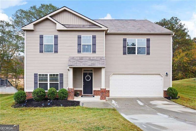 view of front of property with driveway, an attached garage, a front yard, and brick siding