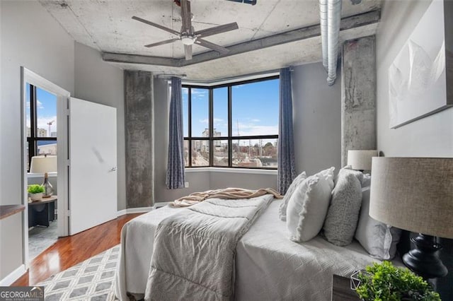 bedroom featuring a ceiling fan and wood finished floors