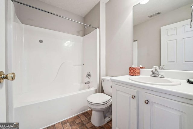 bathroom with bathing tub / shower combination, visible vents, toilet, a textured ceiling, and vanity