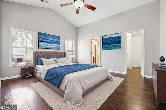 bedroom featuring dark wood-type flooring, multiple windows, and baseboards