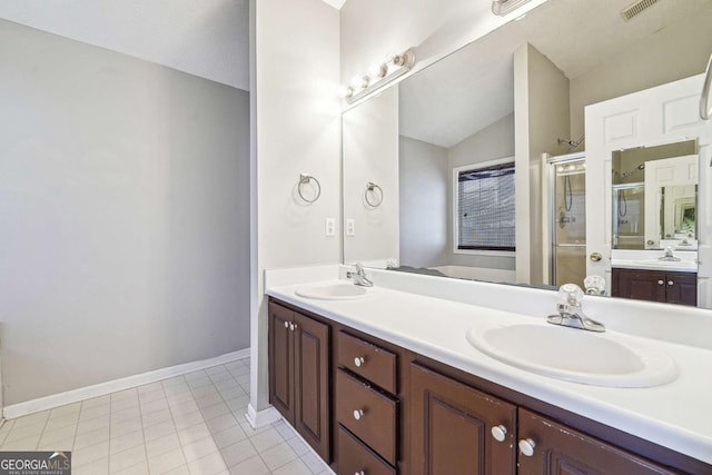 full bathroom featuring vaulted ceiling, a sink, visible vents, and a shower stall