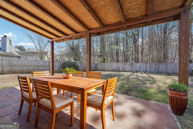 view of patio / terrace featuring outdoor dining area and a fenced backyard