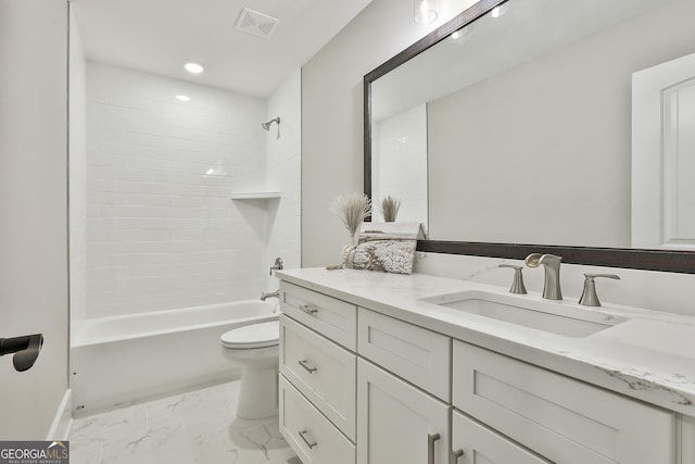 full bathroom with marble finish floor, visible vents, toilet, washtub / shower combination, and vanity