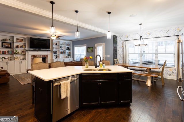 kitchen with open floor plan, light countertops, a sink, and stainless steel dishwasher