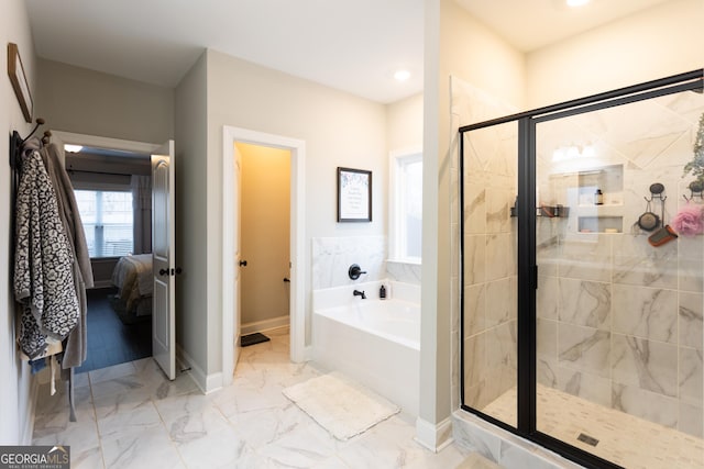 bathroom featuring ensuite bathroom, a garden tub, baseboards, marble finish floor, and a stall shower