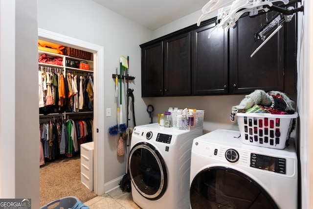 clothes washing area with cabinet space, baseboards, and separate washer and dryer