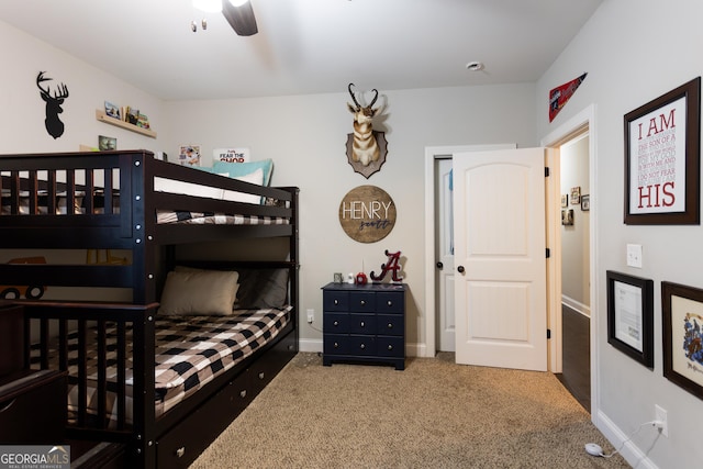 bedroom with carpet floors, ceiling fan, and baseboards