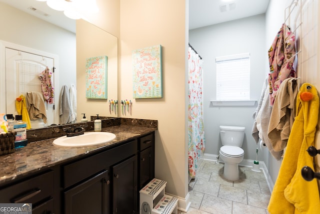 full bathroom with baseboards, visible vents, vanity, and toilet