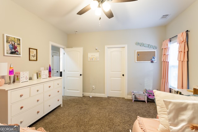 carpeted bedroom featuring visible vents, ceiling fan, and baseboards