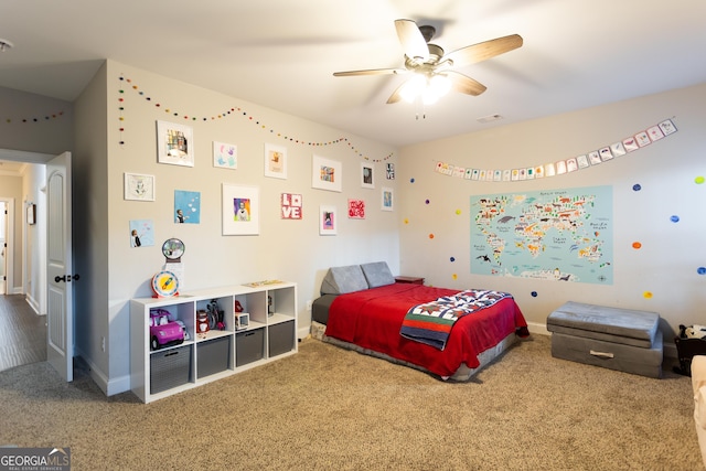 carpeted bedroom with visible vents, ceiling fan, and baseboards