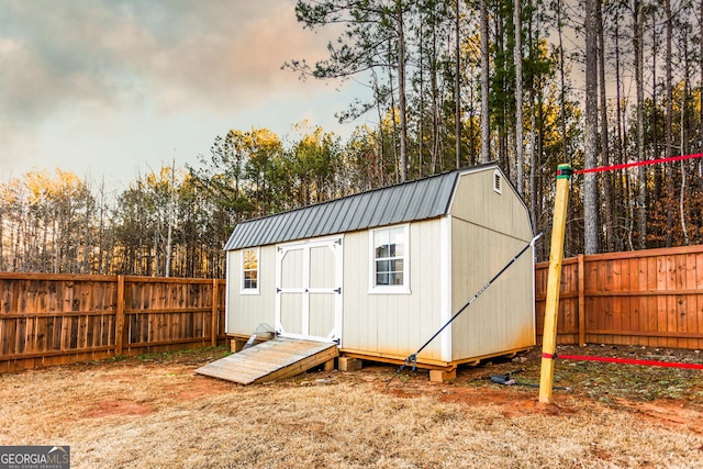 view of shed featuring a fenced backyard