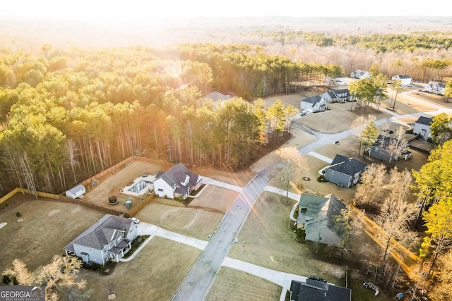 bird's eye view featuring a wooded view