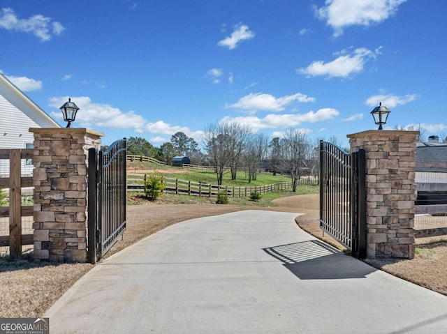 view of gate with fence