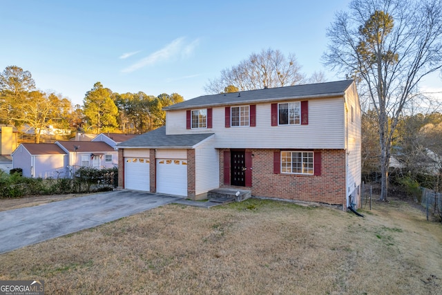 view of front of house featuring brick siding, a front lawn, fence, aphalt driveway, and a garage