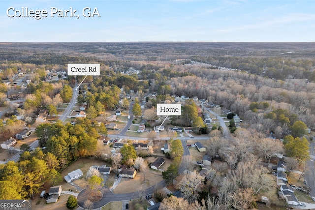 aerial view featuring a view of trees