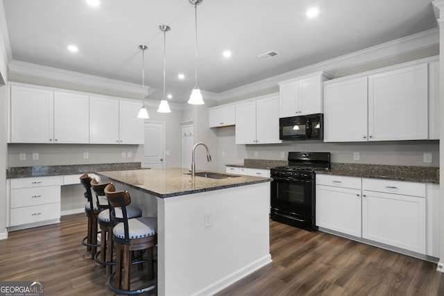 kitchen featuring dark wood finished floors, ornamental molding, white cabinetry, a sink, and black appliances