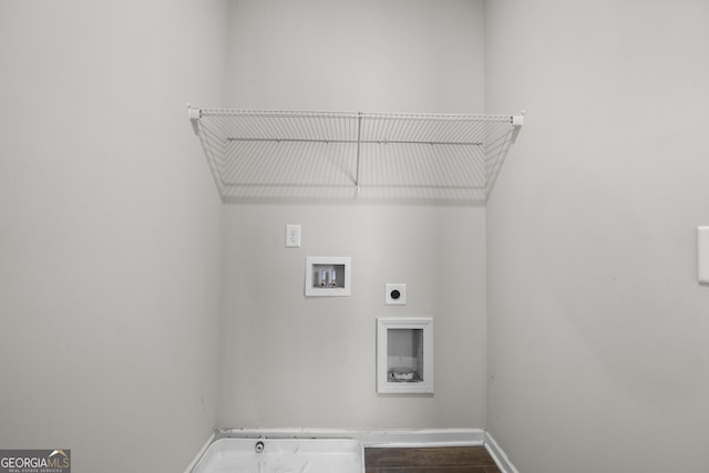 laundry area featuring laundry area, baseboards, dark wood-style floors, hookup for a washing machine, and electric dryer hookup