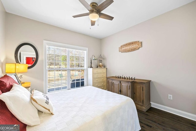 bedroom with a ceiling fan, baseboards, and dark wood-type flooring