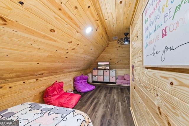 bedroom with dark wood-type flooring, lofted ceiling, wooden ceiling, and wooden walls