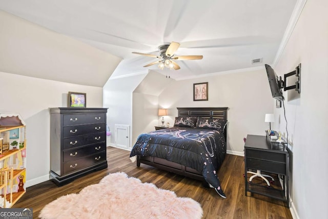 bedroom featuring ornamental molding, wood finished floors, visible vents, and baseboards