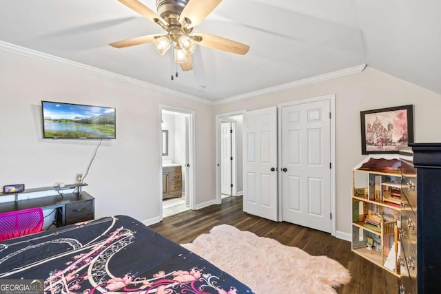 bedroom with crown molding, ensuite bath, wood finished floors, and baseboards