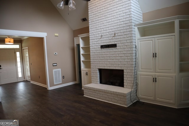 unfurnished living room featuring dark wood-type flooring, a fireplace, visible vents, and baseboards