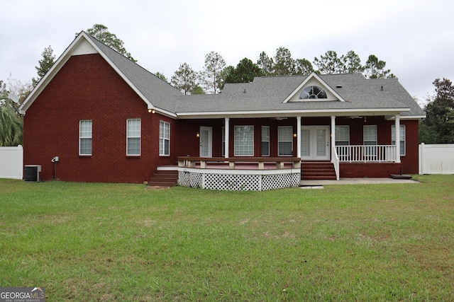 view of front of home featuring a front yard, fence, and brick siding