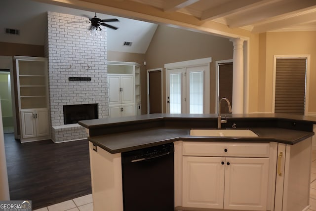 kitchen with a sink, visible vents, dark countertops, and dishwasher