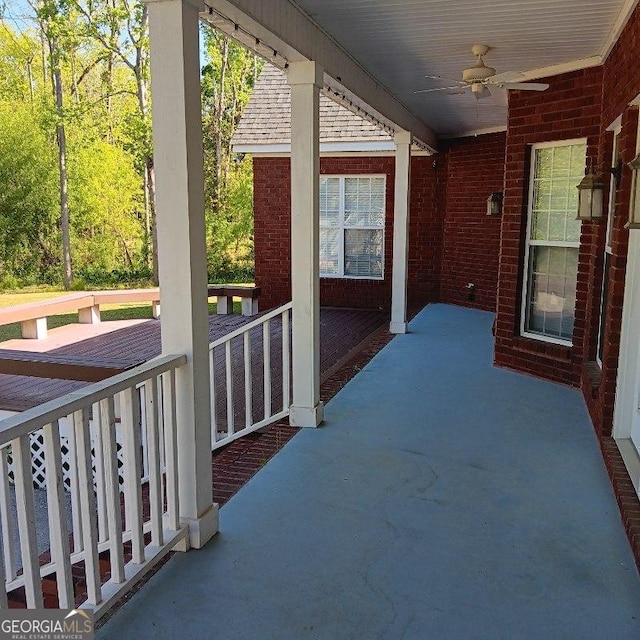 exterior space with ceiling fan
