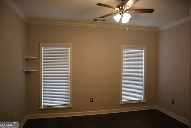 spare room with ornamental molding, baseboards, a ceiling fan, and visible vents