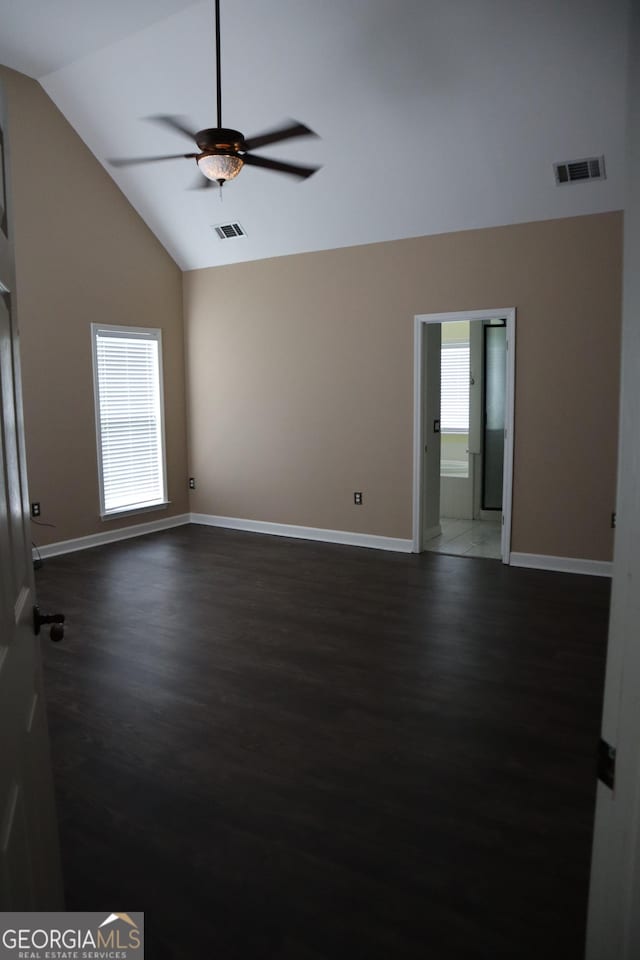 unfurnished room featuring ceiling fan, baseboards, visible vents, and dark wood-style flooring