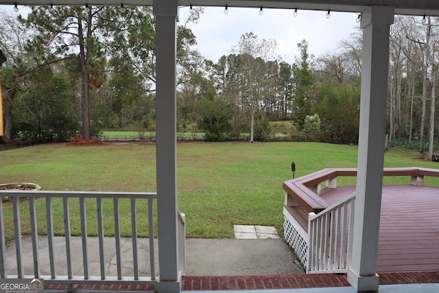 view of yard featuring a wooden deck