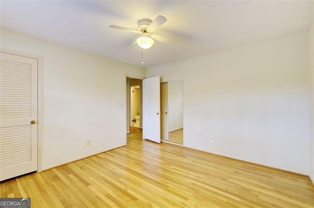 unfurnished bedroom with light wood-style floors and ceiling fan