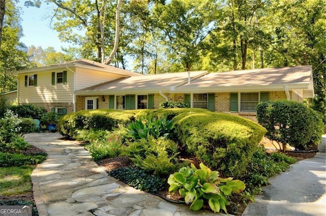 tri-level home with brick siding