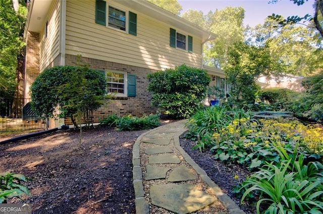 view of home's exterior featuring brick siding