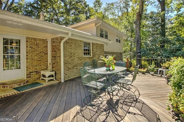 deck featuring outdoor dining area