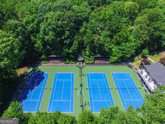 view of tennis court with fence