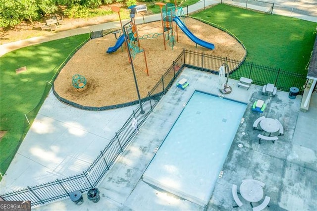 exterior space with playground community and fence