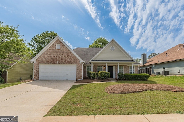 view of front of home with concrete driveway, a front yard, cooling unit, and a garage
