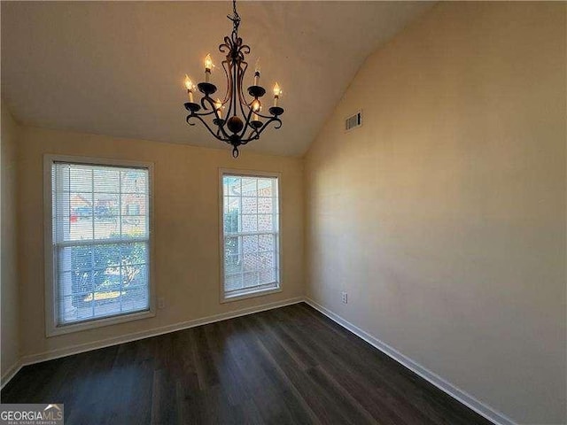 unfurnished dining area with a notable chandelier, visible vents, dark wood-type flooring, vaulted ceiling, and baseboards