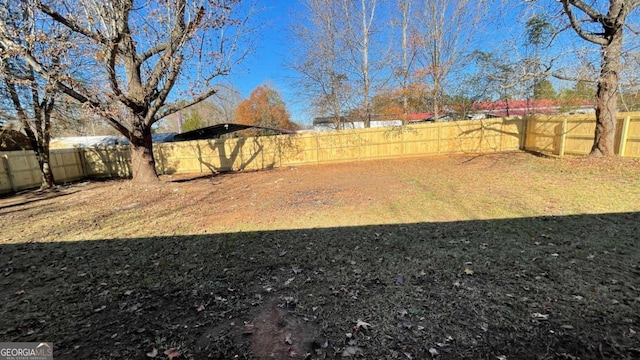 view of yard with a fenced backyard